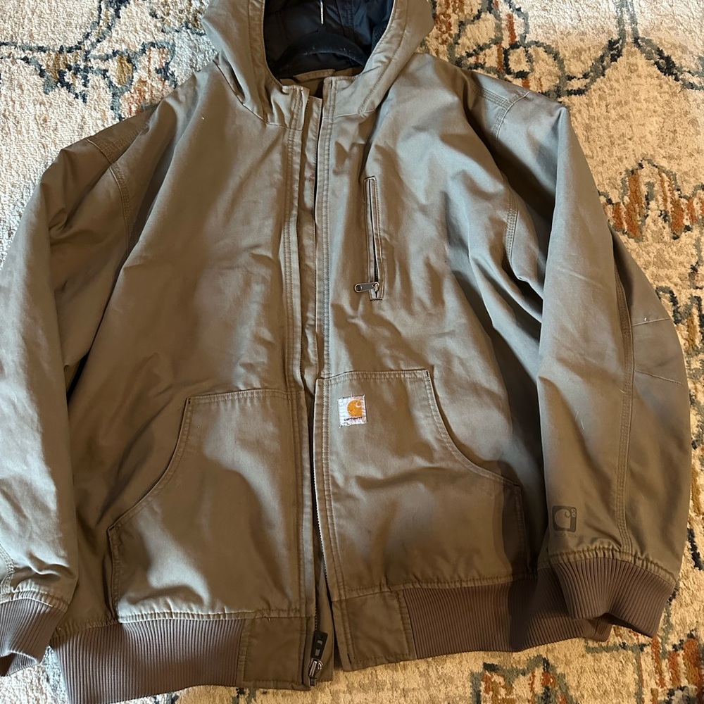 Carhartt jacket.Tan, waterproof with hood.Size 3xl. Like new condition.No stains